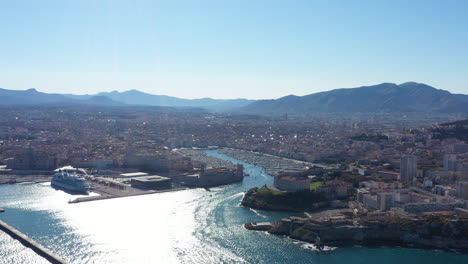 Right-to-left-aerial-traveling-Marseille-harbor-Vieux-Port-big-ferry-mucem